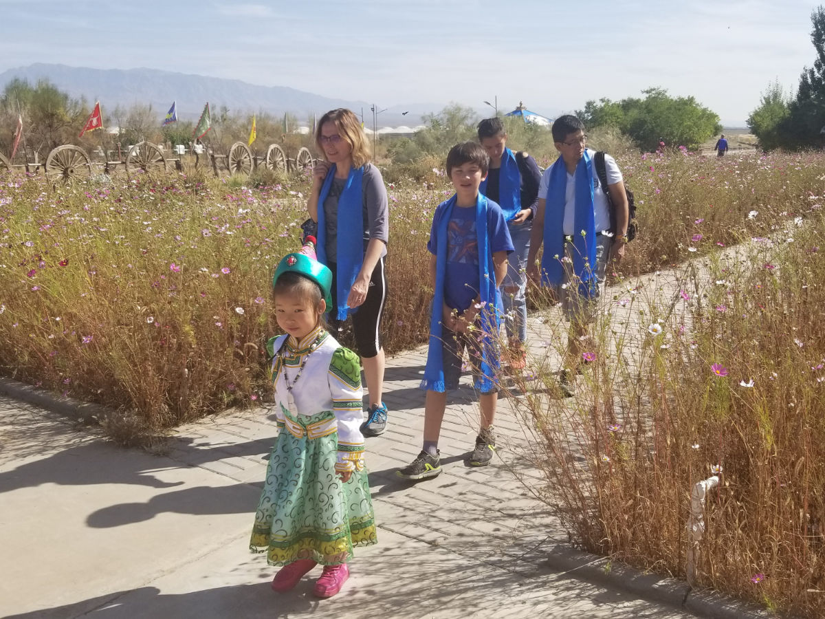 Students exploring the desert with a local guide